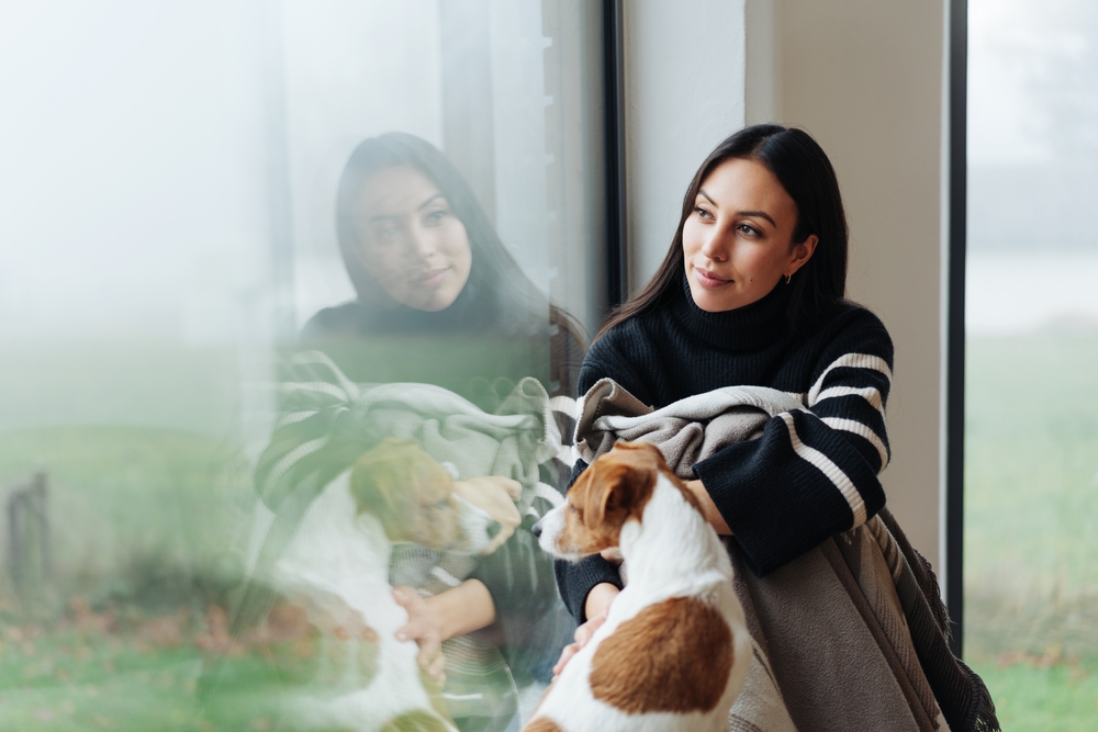 Woman looking through window
